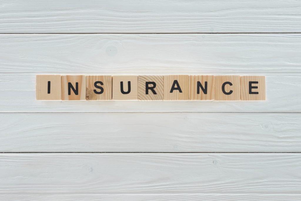 “Insurance” label on desk background for LMI vs protection comparison (Australia, 2025)