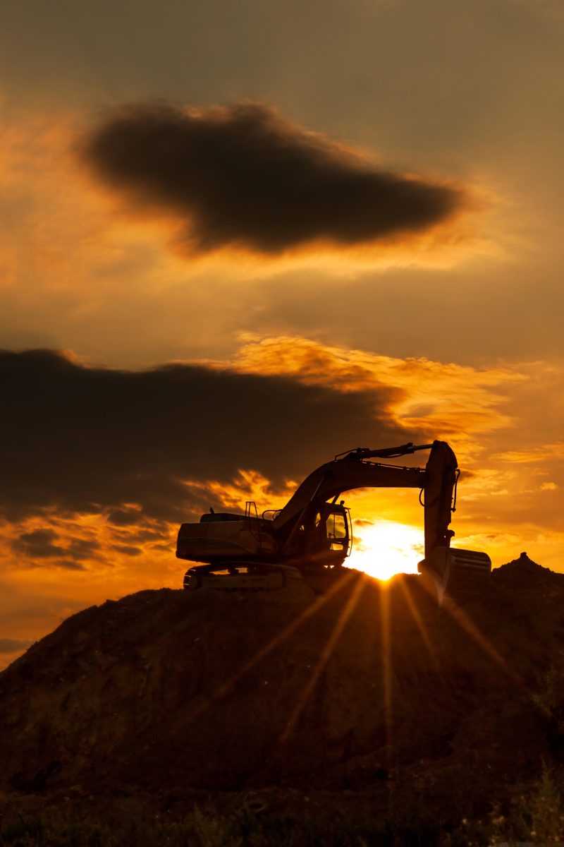 Construction equipment at sunrise on a Victorian job site — equipment finance broker Melbourne helping businesses upgrade machinery