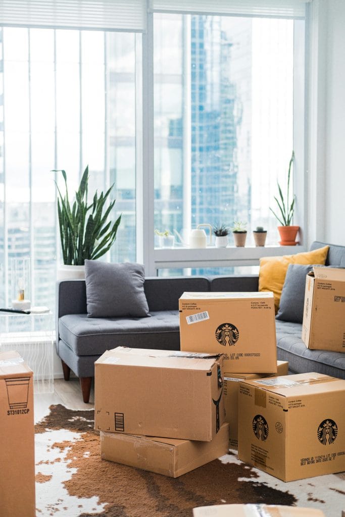 Moving boxes in a bright apartment interior in Geelong, Victoria – first home buyers guide (2025)