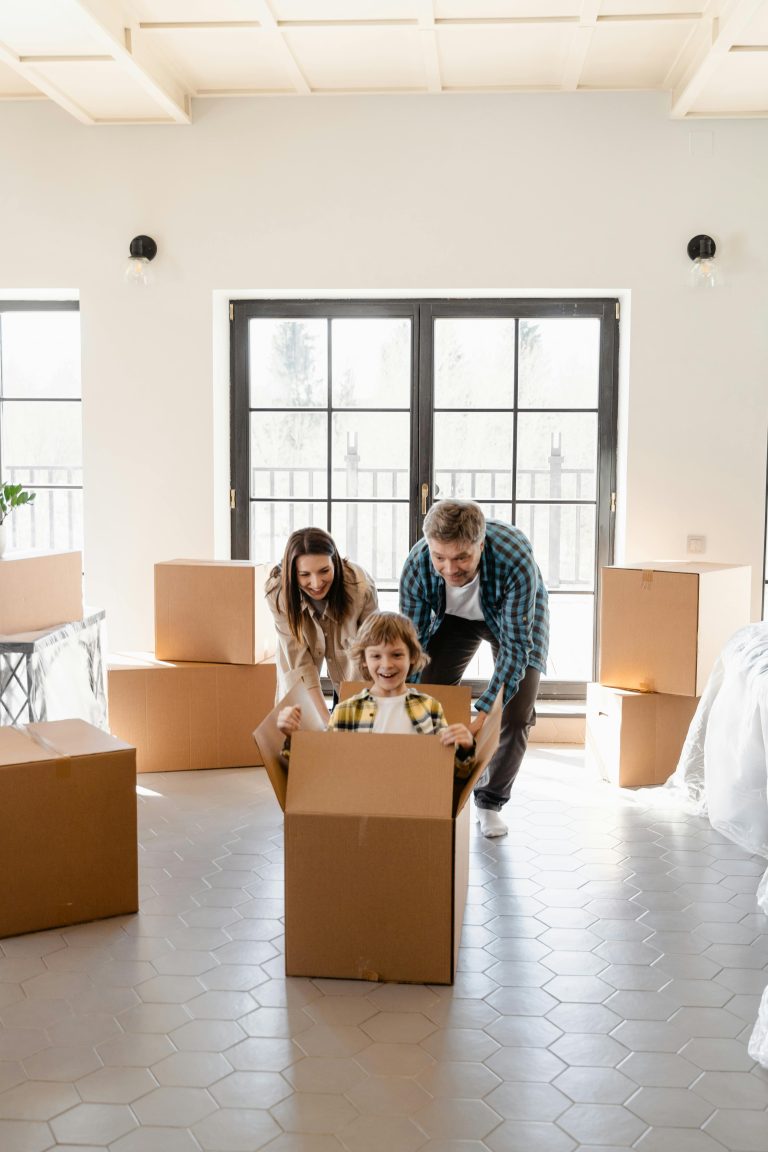 Young family unpacking moving boxes in a light-filled Newtown, Geelong home